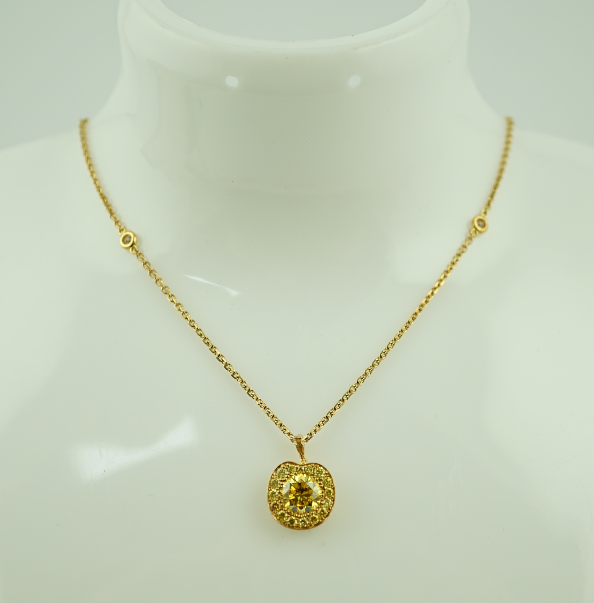 A modern Boodles 18ct gold fancy vivid yellow diamond cluster set pendant necklace on a two stone diamond set chain, with clasp and Boodles ring set with small brilliants